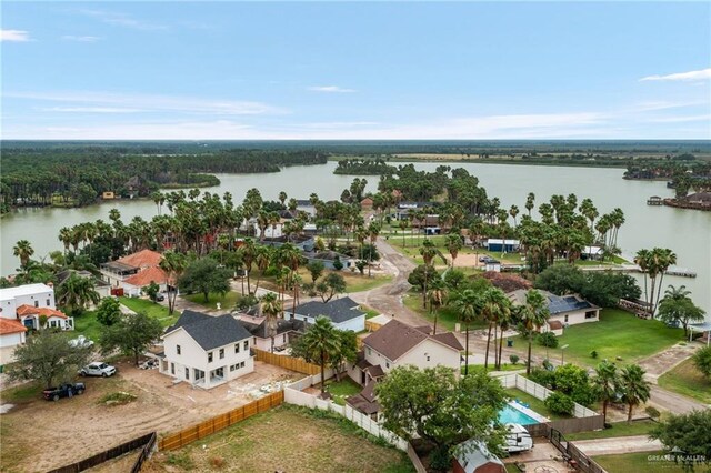 birds eye view of property with a water view