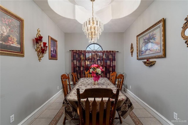 tiled dining space with an inviting chandelier