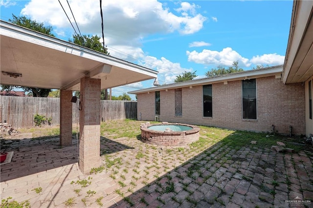 view of patio featuring an outdoor hot tub