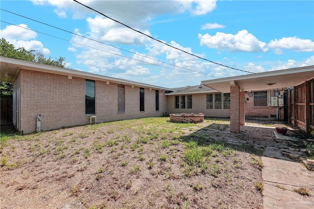 rear view of property with a yard