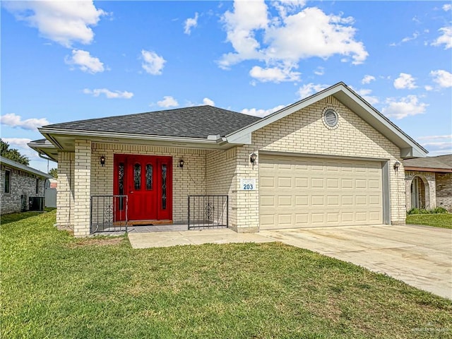 view of front of home featuring a garage and a front yard