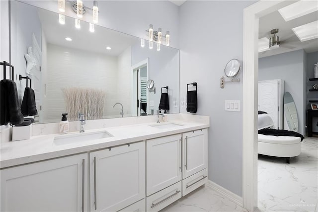 218 Stella Dr, San Juan, TX 78589 - ensuite bathroom with marble look tiles, baseboards, double vanity, ceiling fan, and recessed lighting