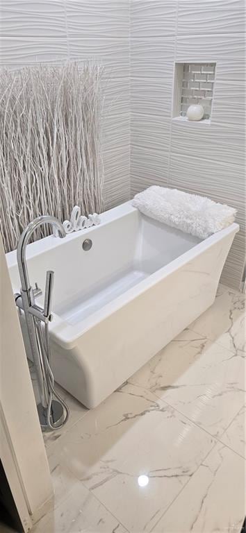 218 Stella Dr, San Juan, TX 78589 - bathroom with a soaking tub and marble finish floors