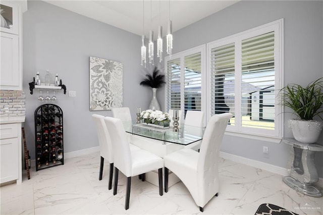 218 Stella Dr, San Juan, TX 78589 - dining area featuring light marble finish flooring and baseboards