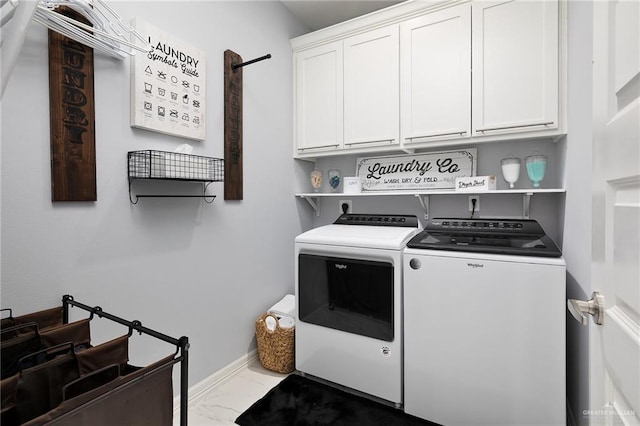 218 Stella Dr, San Juan, TX 78589 - washroom with cabinet space, washer and clothes dryer, marble look tiles, and baseboards
