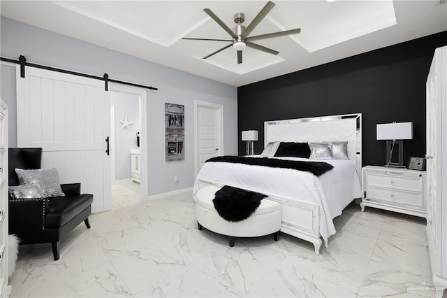 218 Stella Dr, San Juan, TX 78589 - bedroom featuring a barn door, marble finish flooring, baseboards, ceiling fan, and connected bathroom