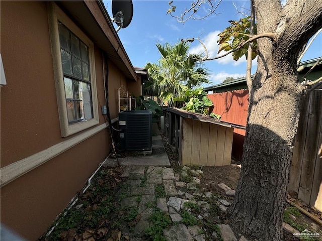 view of side of property with cooling unit