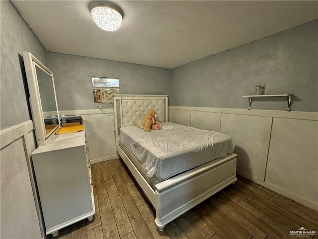 bedroom featuring dark hardwood / wood-style floors