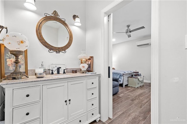 3313 Cornell Ave, Mcallen, TX 78504 - bathroom with vanity, a wall mounted AC, and wood finished floors