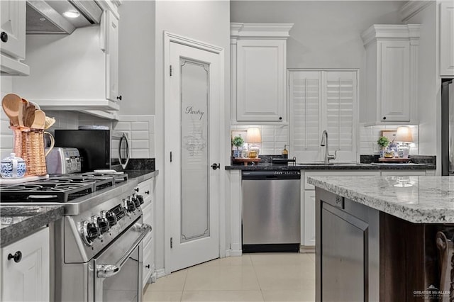 3313 Cornell Ave, Mcallen, TX 78504 - kitchen featuring appliances with stainless steel finishes, decorative backsplash, and a sink
