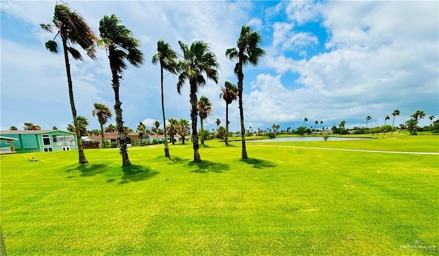 572 Sand Dollar Dr, Port Isabel, TX 78578 - view of property's community featuring a lawn, golf course view, and a water view