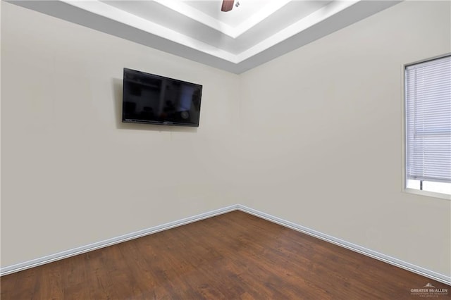 spare room with ceiling fan and wood-type flooring