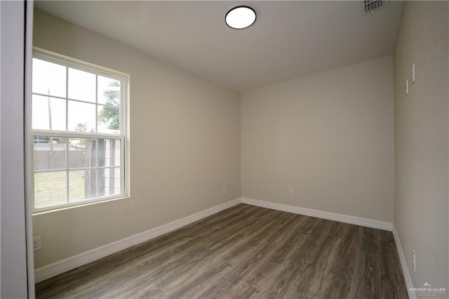 empty room featuring dark hardwood / wood-style floors