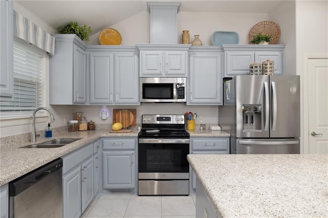 311 S Templo Dorado St, Mission, TX 78572 - kitchen featuring appliances with stainless steel finishes, light tile patterned floors, and gray cabinets