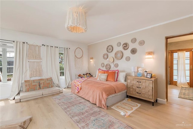 1011 W Orange St, Mcallen, TX 78501 - bedroom featuring wood finished floors and crown molding