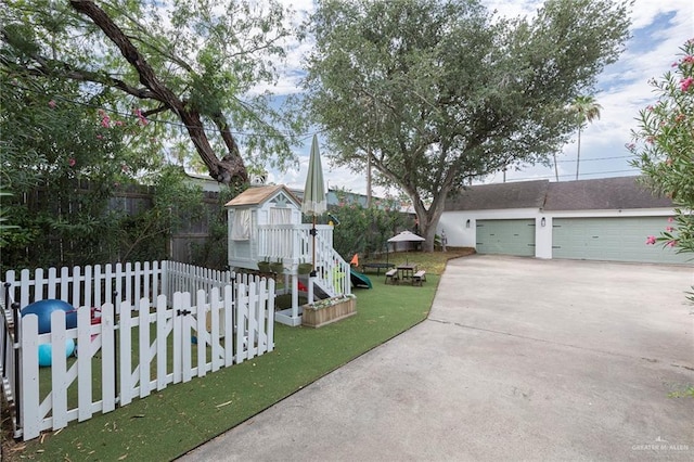 1011 W Orange St, Mcallen, TX 78501 - view of front of house featuring a playground and a detached garage