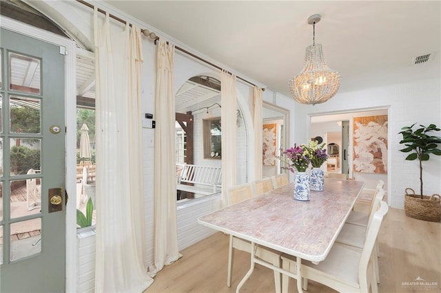 1011 W Orange St, Mcallen, TX 78501 - dining area featuring a chandelier and wood finished floors