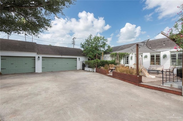 1011 W Orange St, Mcallen, TX 78501 - view of front of home with a garage