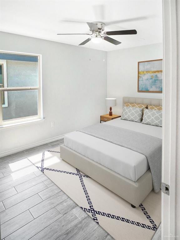 bedroom featuring ceiling fan and light wood-type flooring