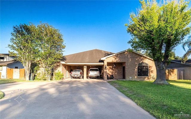 view of front of property with a front yard and a carport