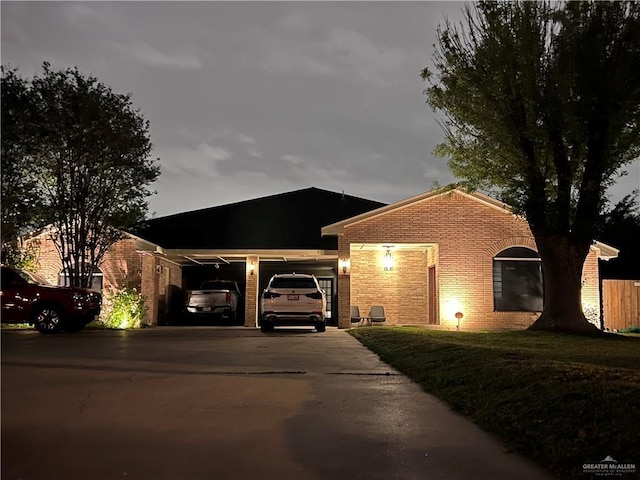 ranch-style house featuring a front lawn and a garage