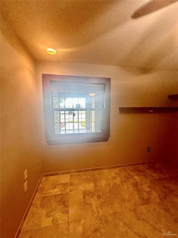 interior space featuring a textured ceiling