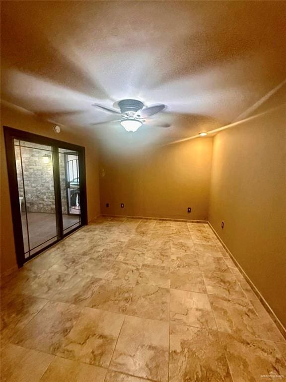 spare room with a textured ceiling