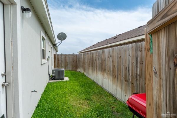 1009 W La Pointe Ave, Mission, TX 78573 - view of yard featuring central AC unit