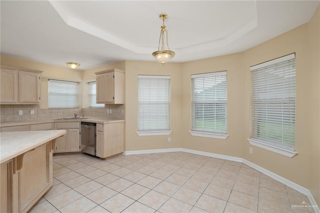 kitchen featuring dishwasher, decorative light fixtures, tasteful backsplash, and a healthy amount of sunlight