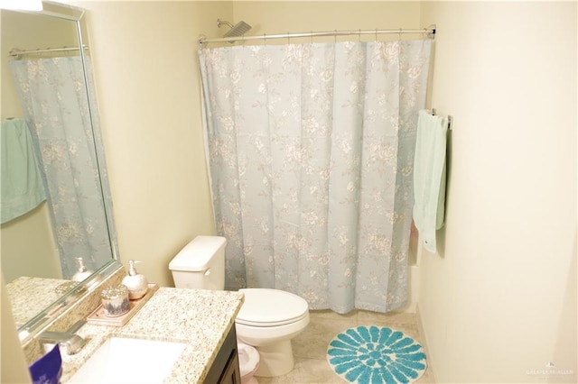 bathroom with tile patterned flooring, vanity, curtained shower, and toilet