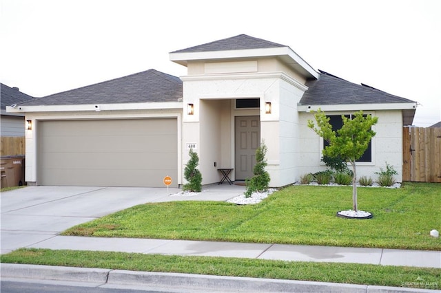 view of front facade featuring a front yard and a garage