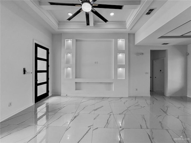 foyer entrance with ceiling fan, french doors, and a tray ceiling