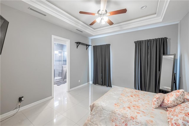 3527 Oak Preserve St, Weslaco, TX 78599 - bedroom featuring a raised ceiling, visible vents, light tile patterned flooring, baseboards, and ensuite bathroom