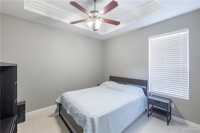 3527 Oak Preserve St, Weslaco, TX 78599 - bedroom with a tray ceiling, baseboards, ceiling fan, and light tile patterned floors