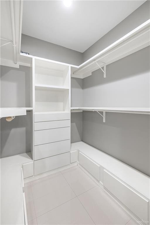 3527 Oak Preserve St, Weslaco, TX 78599 - walk in closet featuring tile patterned floors