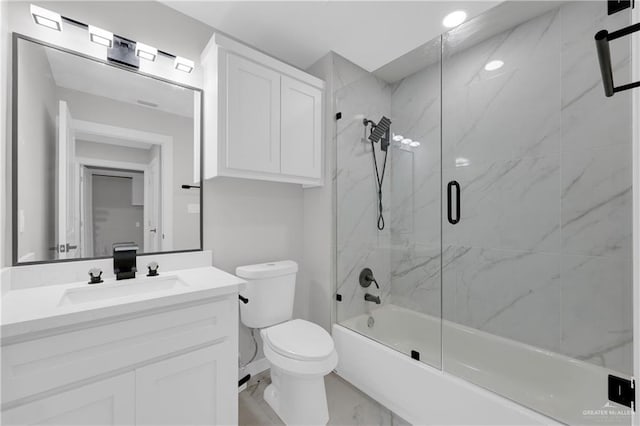 full bathroom featuring enclosed tub / shower combo, vanity, and toilet