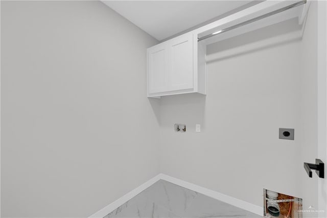 laundry room featuring cabinets and hookup for an electric dryer