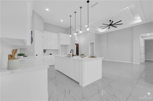 503 Purple Bugambilia, Pharr, TX 78577 - kitchen with white cabinets, light marble finish flooring, modern cabinets, a sink, and light countertops