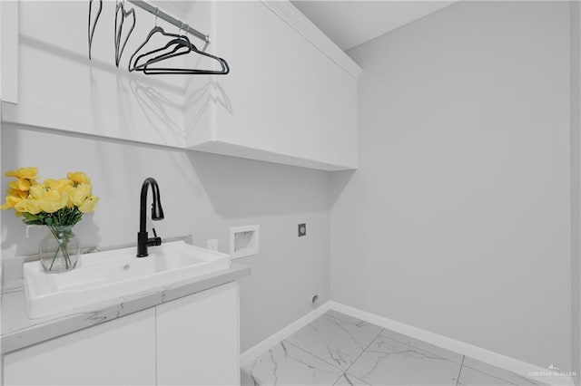 503 Purple Bugambilia, Pharr, TX 78577 - washroom featuring washer hookup, electric dryer hookup, baseboards, light marble finish floors, and cabinet space