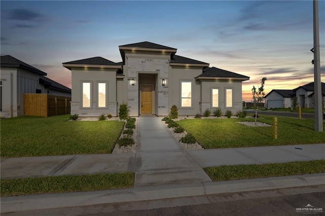 2214 N Gaytan St, Edinburg, TX 78542 - view of front of home with stucco siding, roof with shingles, and concrete driveway
