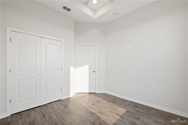 2214 N Gaytan St, Edinburg, TX 78542 - unfurnished bedroom featuring wood finished floors, baseboards, a closet, and ceiling fan
