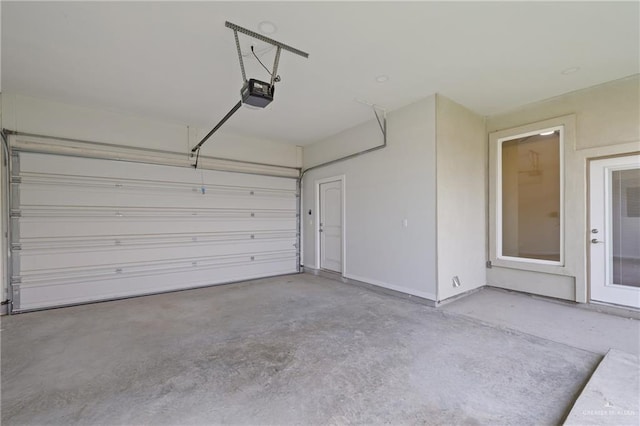 2214 N Gaytan St, Edinburg, TX 78542 - garage with a garage door opener and baseboards