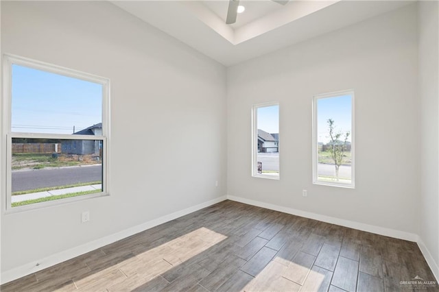 2214 N Gaytan St, Edinburg, TX 78542 - spare room with wood finished floors, ceiling fan, baseboards, and a raised ceiling