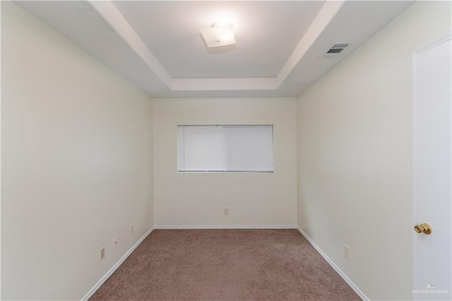 1610 E Yary Dr, Edinburg, TX 78542 - spare room featuring a raised ceiling, carpet, visible vents, and baseboards