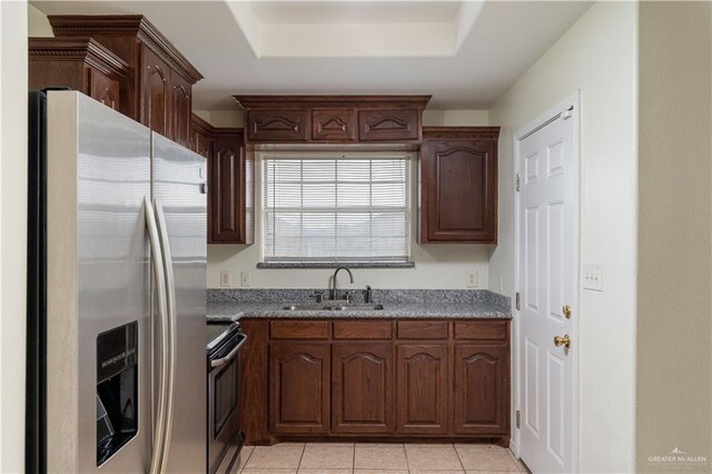 1610 E Yary Dr, Edinburg, TX 78542 - kitchen featuring appliances with stainless steel finishes, a tray ceiling, a sink, and light tile patterned floors