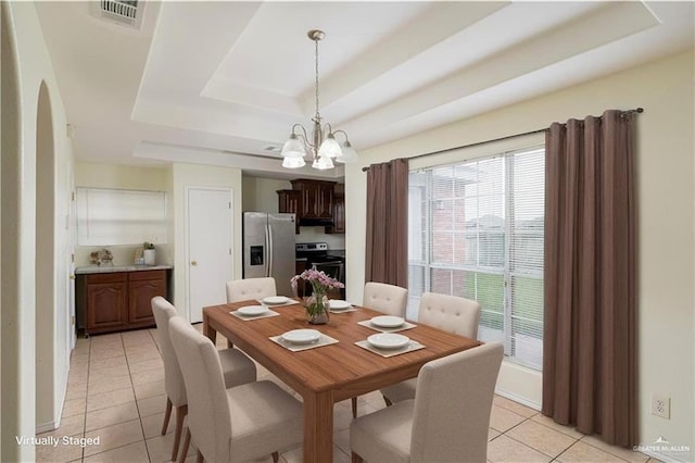 1610 E Yary Dr, Edinburg, TX 78542 - dining space with a notable chandelier, light tile patterned flooring, a tray ceiling, and visible vents