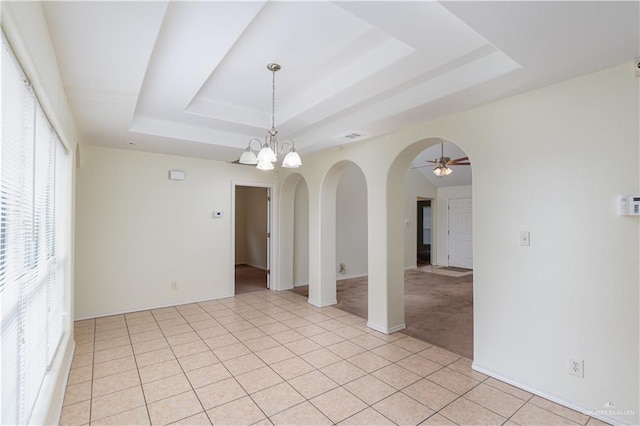 1610 E Yary Dr, Edinburg, TX 78542 - unfurnished room featuring light tile patterned floors, arched walkways, a ceiling fan, and a raised ceiling