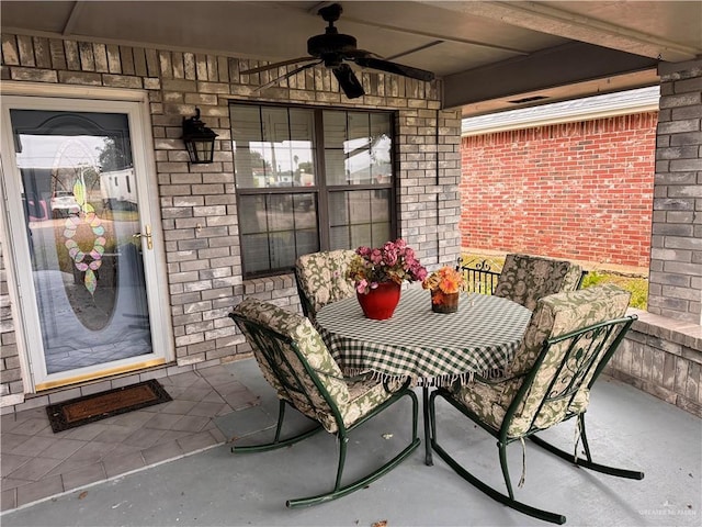 view of patio featuring ceiling fan