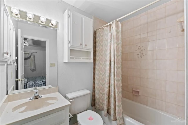 full bathroom featuring vanity, toilet, and shower / tub combo