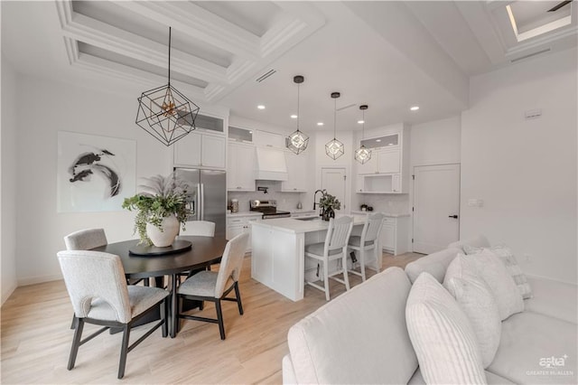 dining room featuring visible vents, coffered ceiling, light wood-type flooring, beam ceiling, and recessed lighting